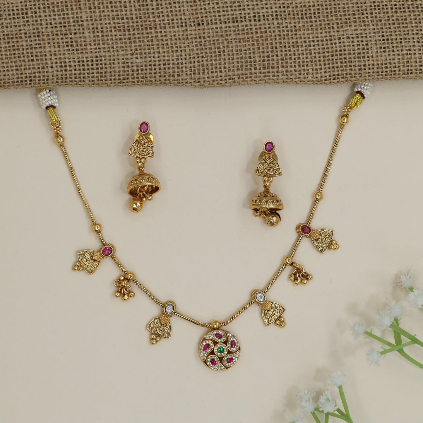 Bridal kundan necklace with decorative pendant arrangement