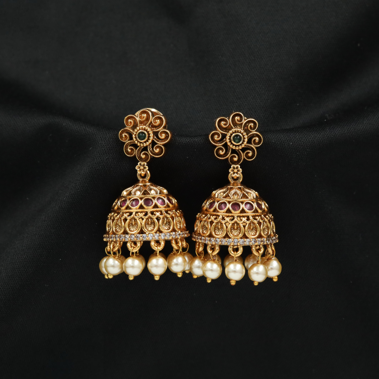 Royal Antique Gold Finish Jhumkas Featuring Swirl Petal Top and Bell Drop