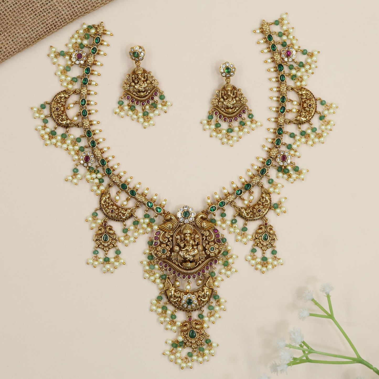 Temple Ganesha necklace with crescent links and floral bead accents