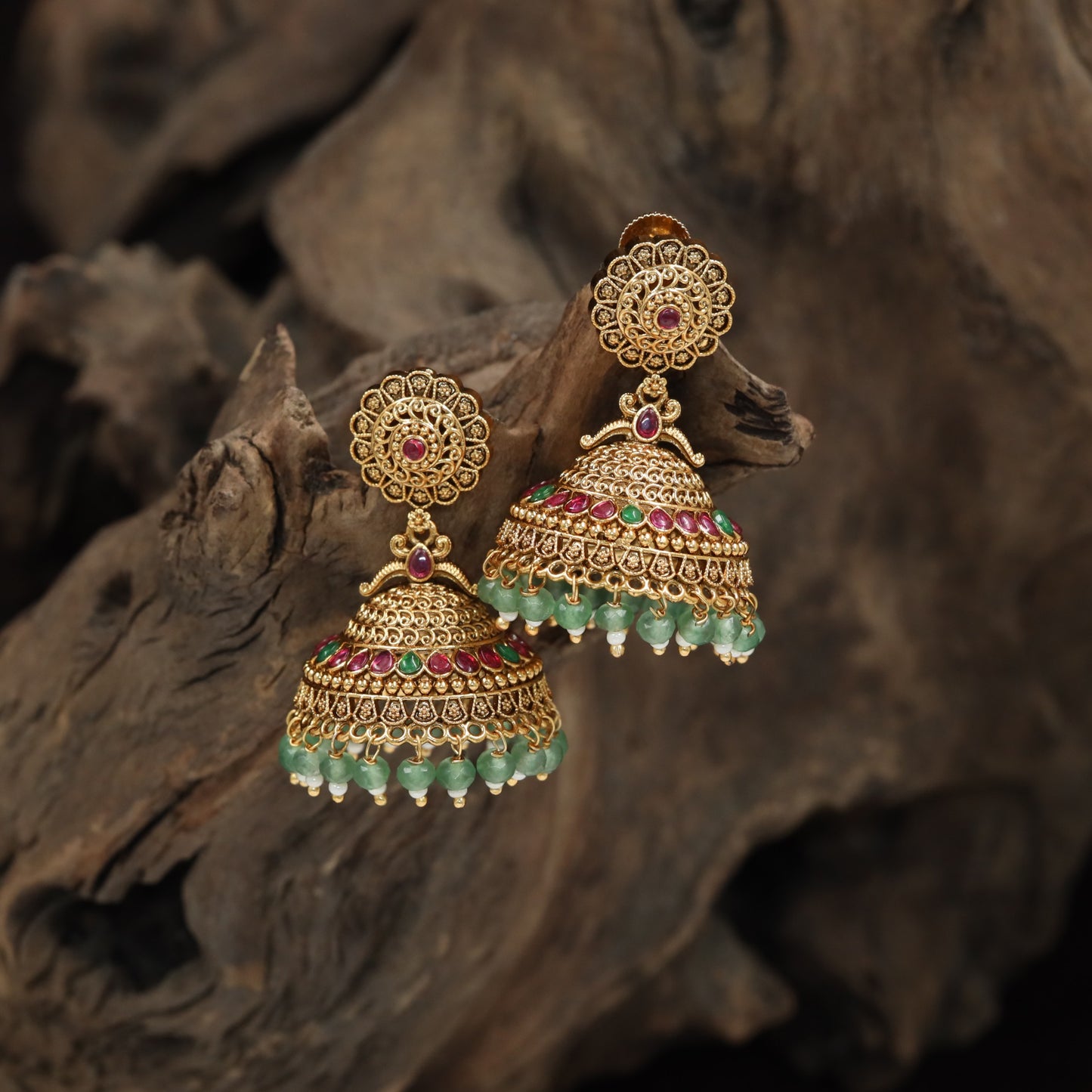 Intricate jhumka with floral medallion top and layered dome design