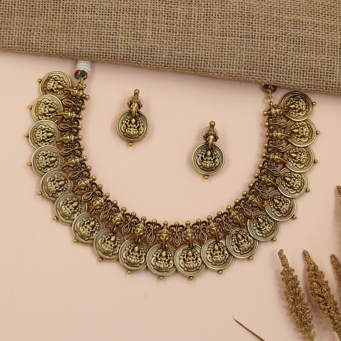 Divine Temple Necklace with Repeating Lakshmi Coins and Ornamental Ganesha Design