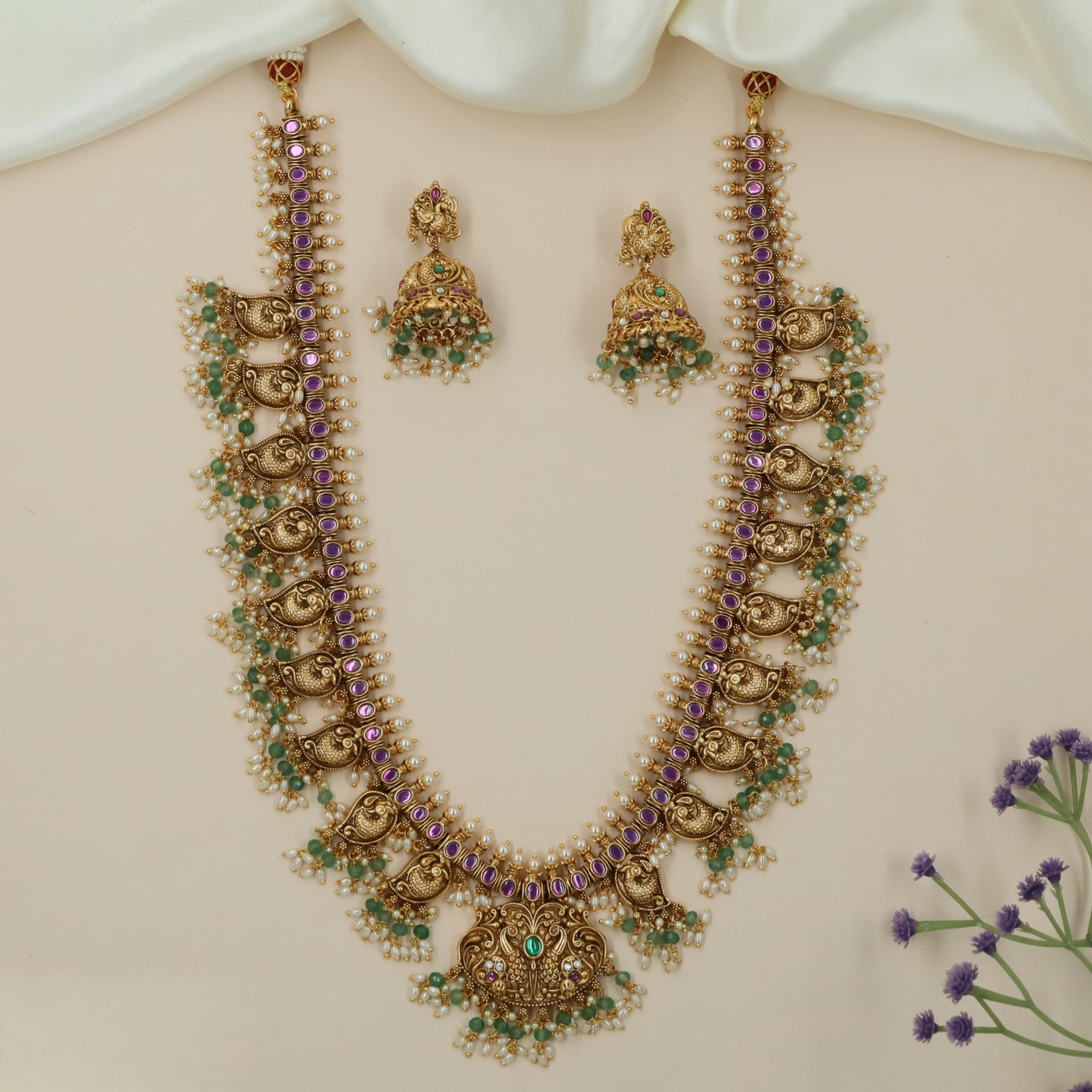 Ornamental Antique Long Haara Featuring Sculpted Peacock Elements and Pearl Tassels