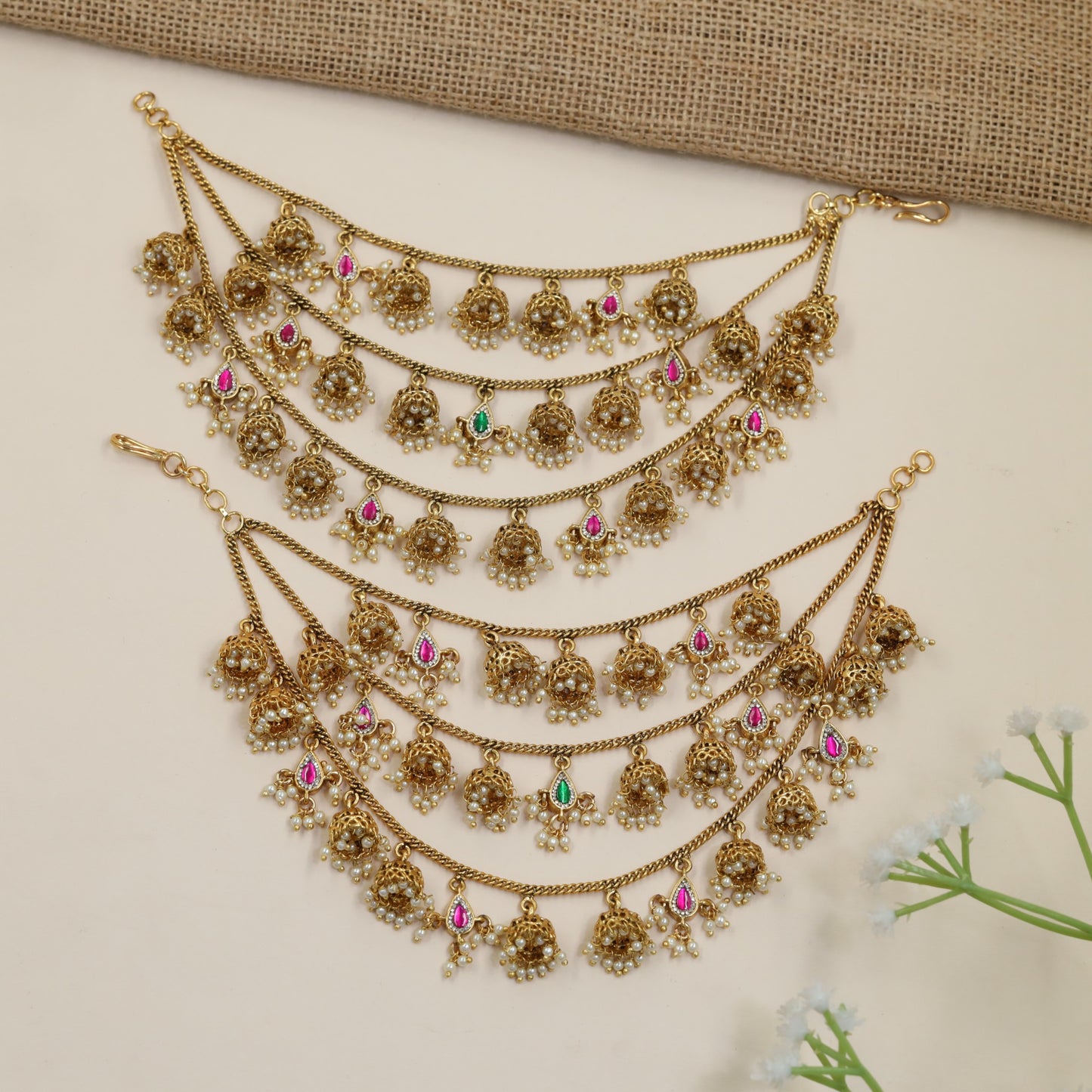 Antique Mati Featuring Curved Chains and Ornamental Pendants