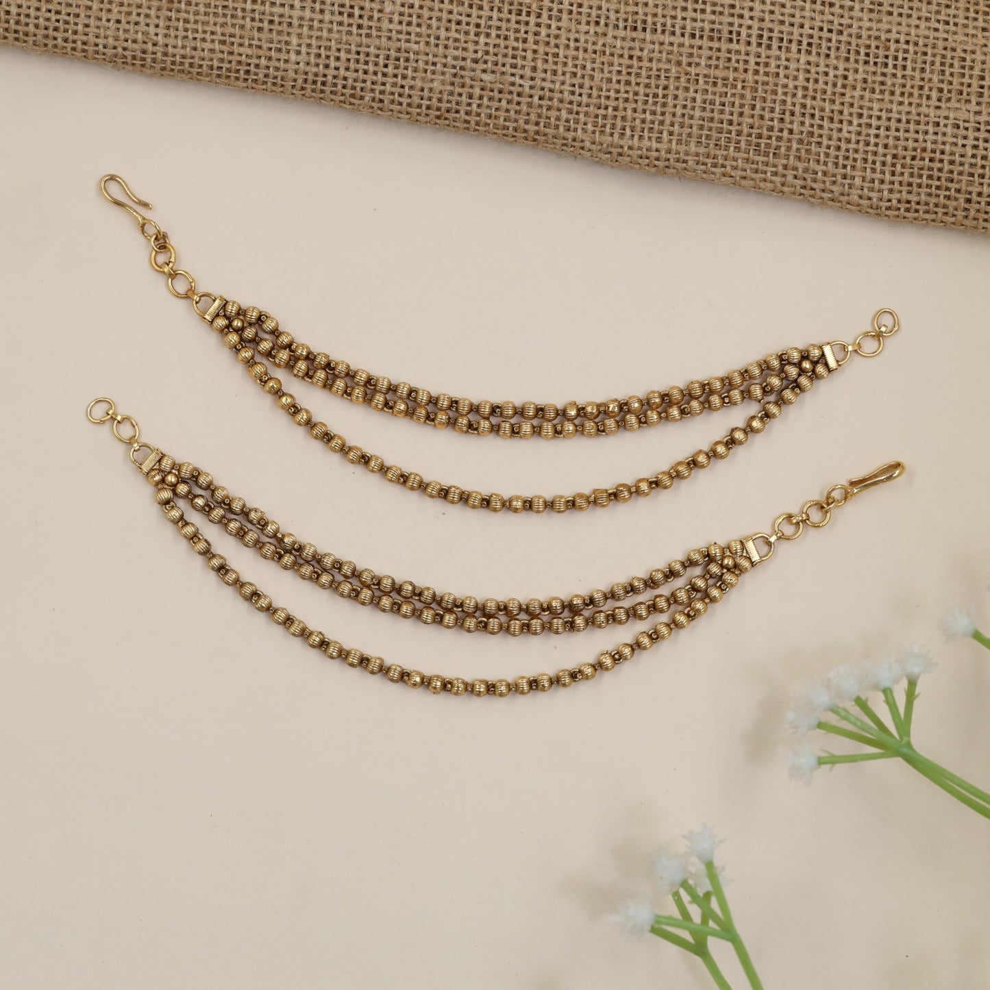 Antique Mati Featuring Curved Bead Chains and Intricate Links