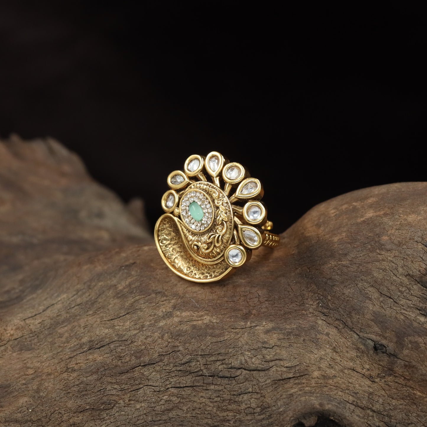 Antique Finger Ring with Teardrop Framing and Detailed Circular Medallion Work
