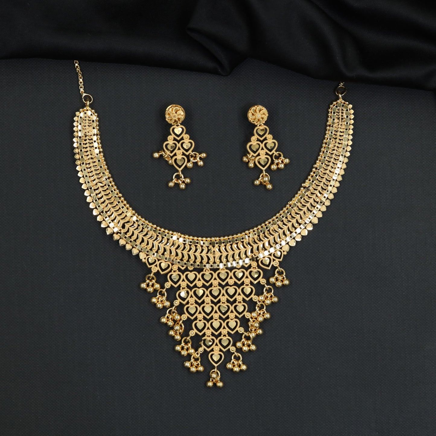 Auspicious ceremonial Forming Necklace styled with tapering heart apron
