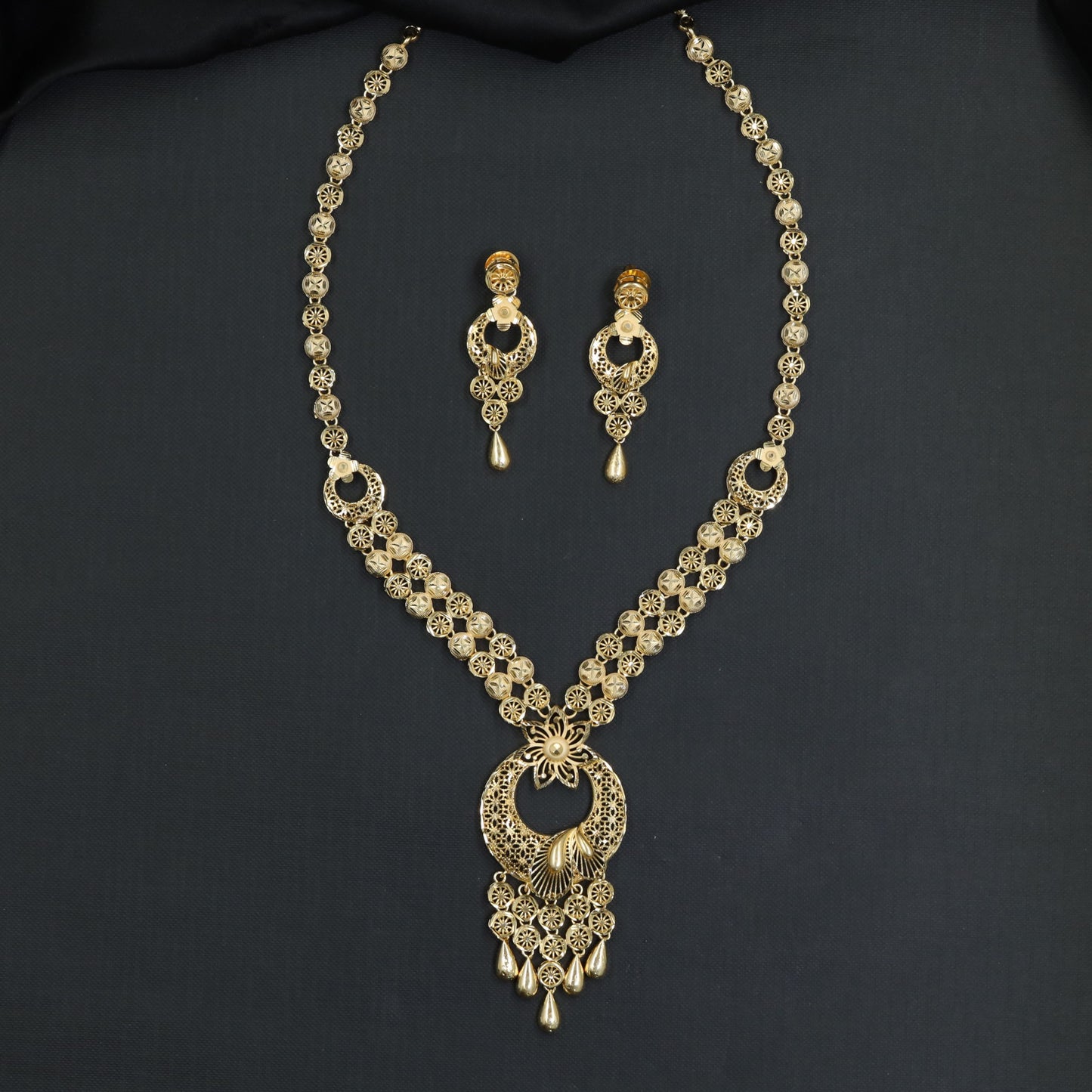 Floral Circular Linkwork with Hanging Drops Forming Long Haara