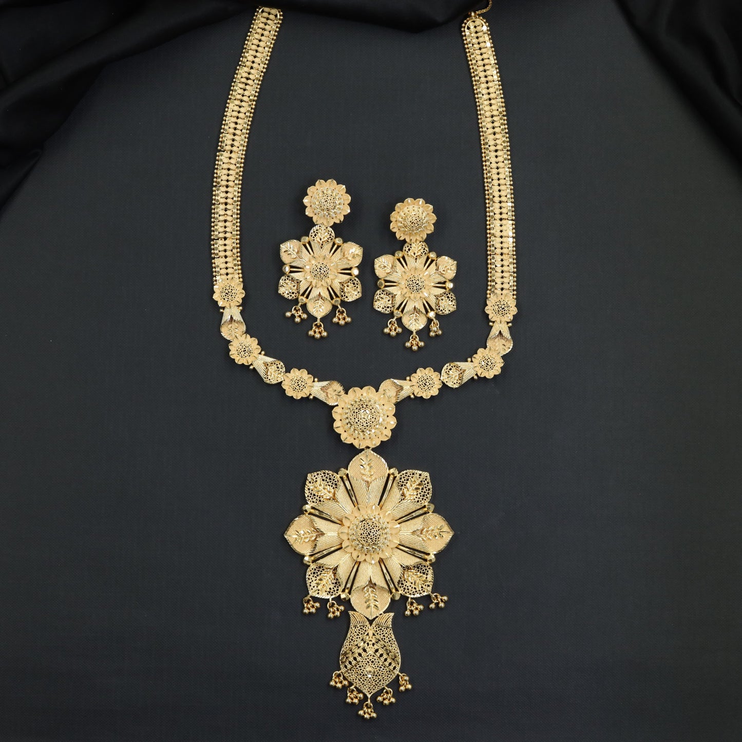 Classic Floral Forming Long Haara with Repeating Medallion Links