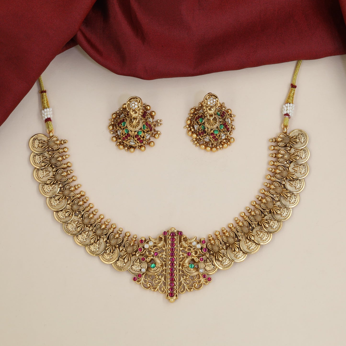 Traditional Peacock and Lakshmi Coin Design Featured in an Antique Necklace
