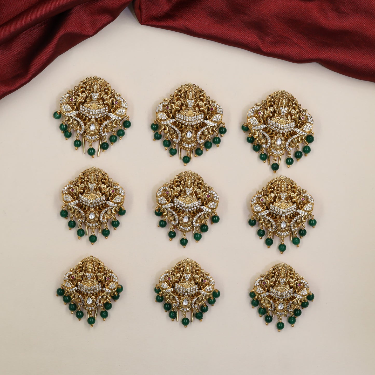 Signature Antique Jade Bille featuring seated Lakshmi and elaborate ornamental work