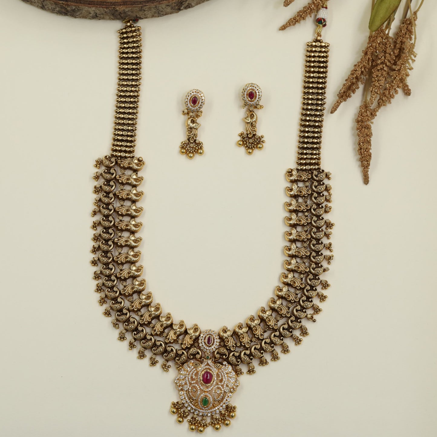 Antique Long Haara with Sculpted Peacock Links and Oval Pendant Detailing