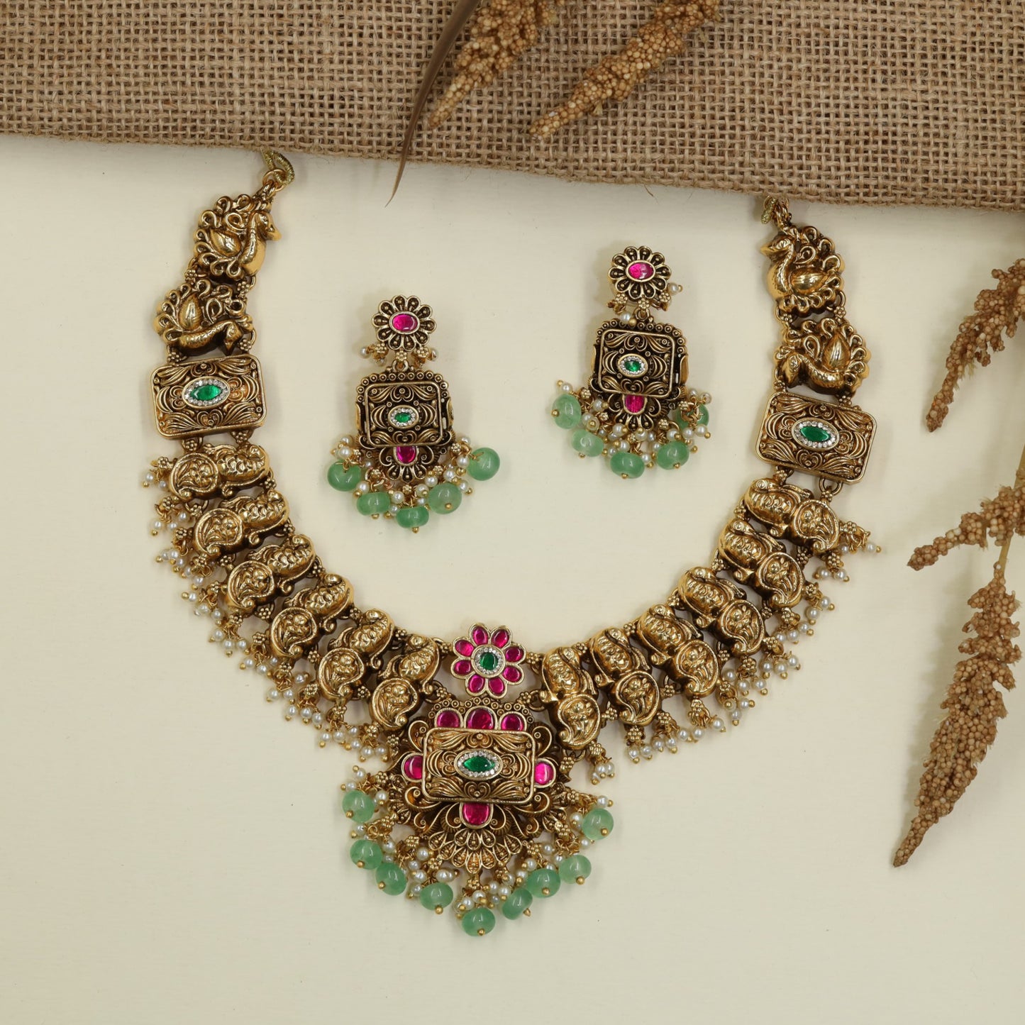 Antique Necklace with Sculpted Peacock Details and Ornate Floral Pendant