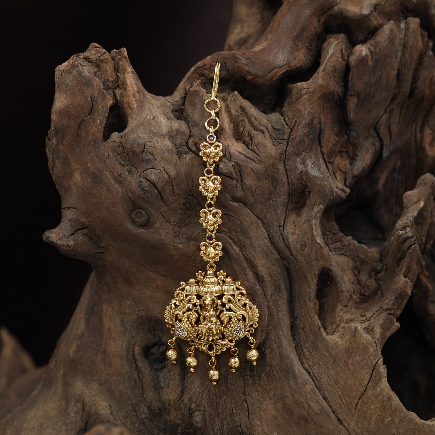 Refined Lakshmi Antique Tikka with peacock flourishes and decorative linkwork