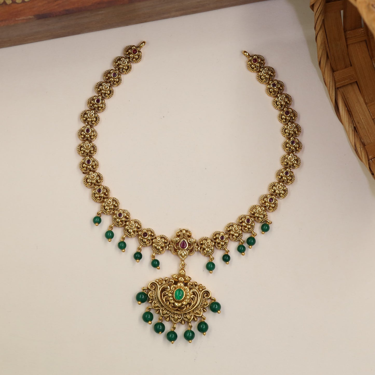 Classical Necklace Featuring Repeating Floral Sections And Hanging Elements