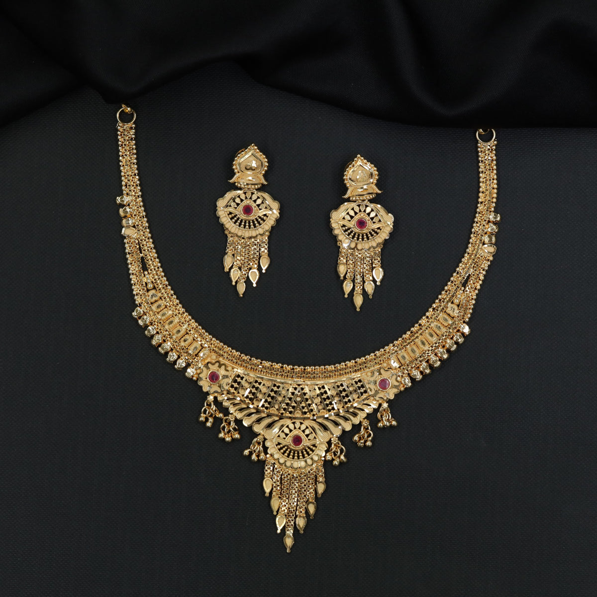 Graceful Gold Plated Necklace With Sculpted Central Pendant And Delicate Hanging Details