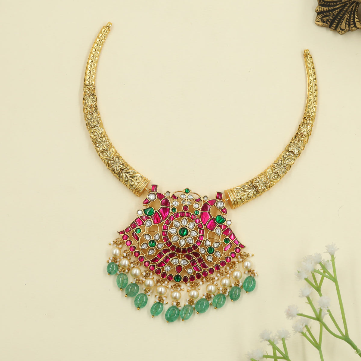 Jadau Necklace featuring sculpted peacocks and ornamental work