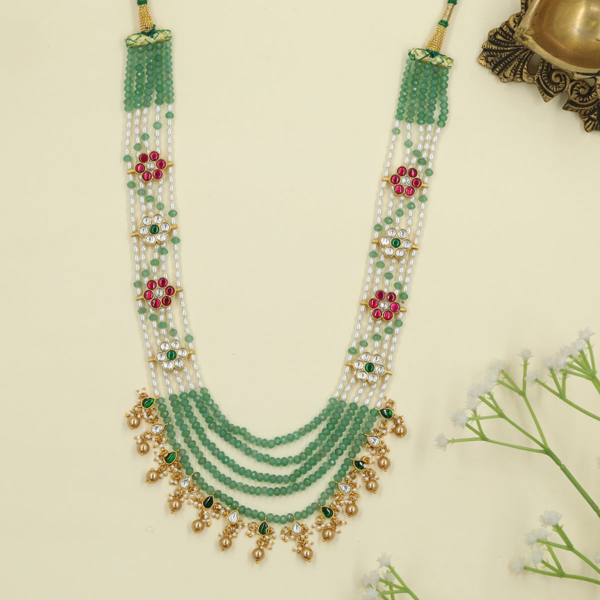 Jadau Long Haara with floral links and delicate hanging drops