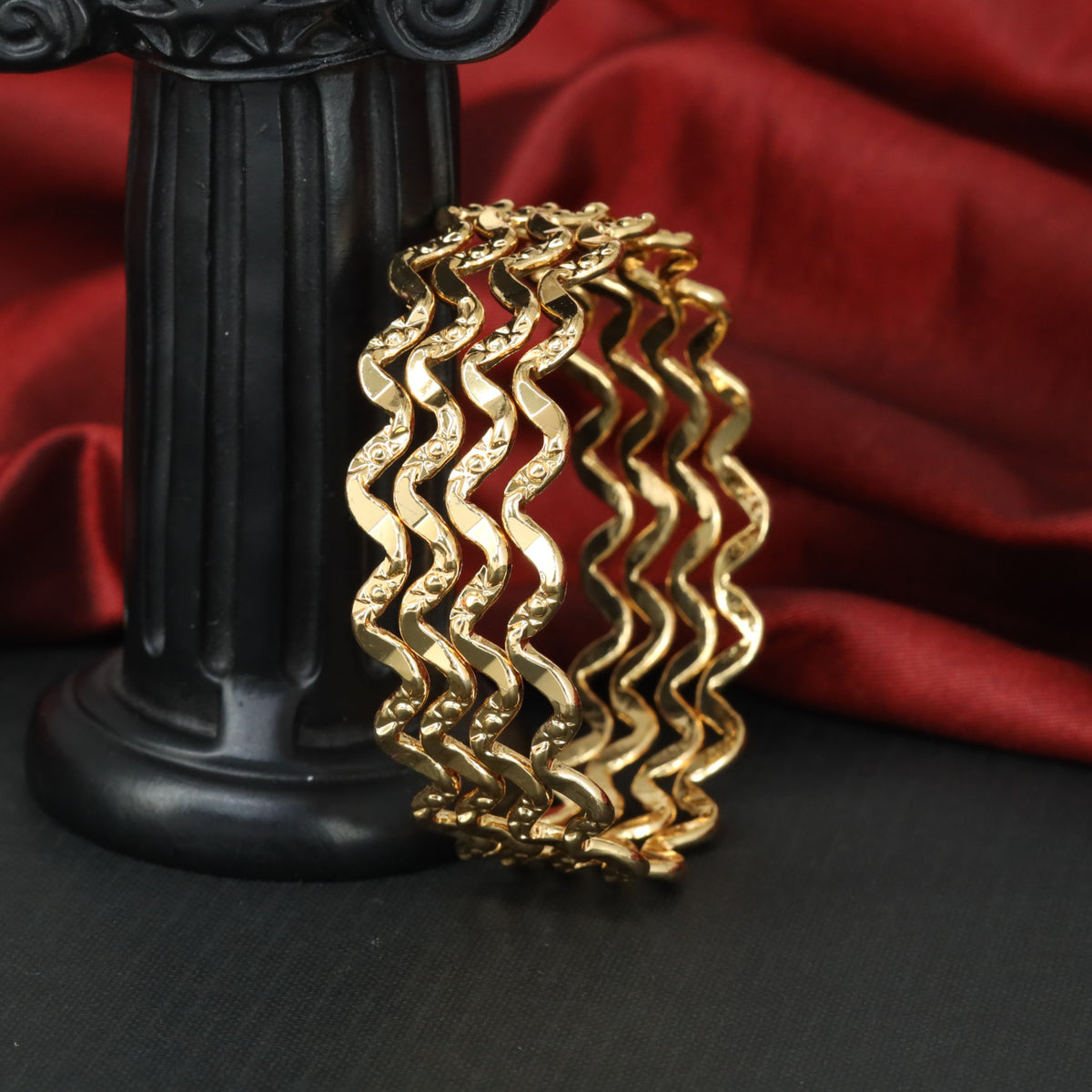 Premium Gold bangles with detailed flowing patterns