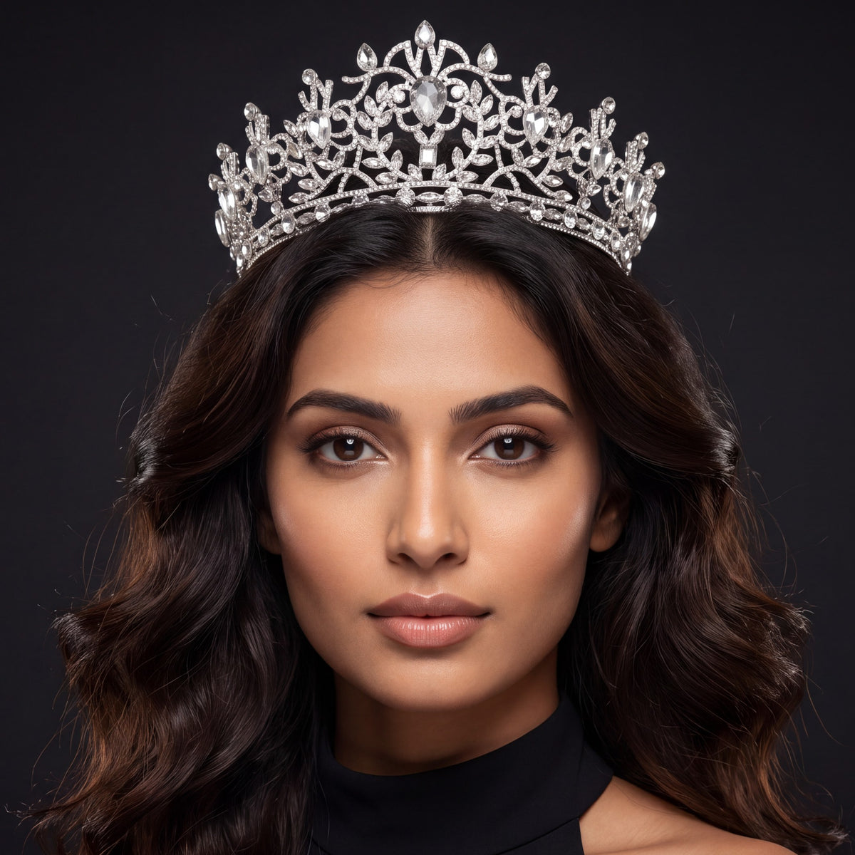 A graceful Crown showcasing curling vines, delicate leaves and an elevated centre