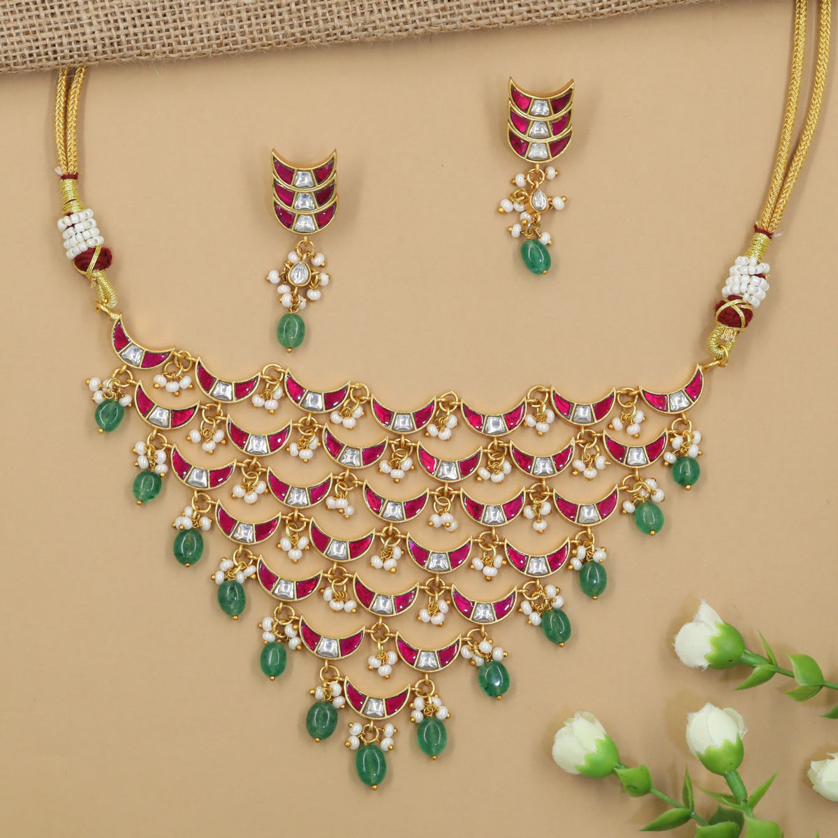 Traditional jadau choker with graduated crescent links and delicate bead drops