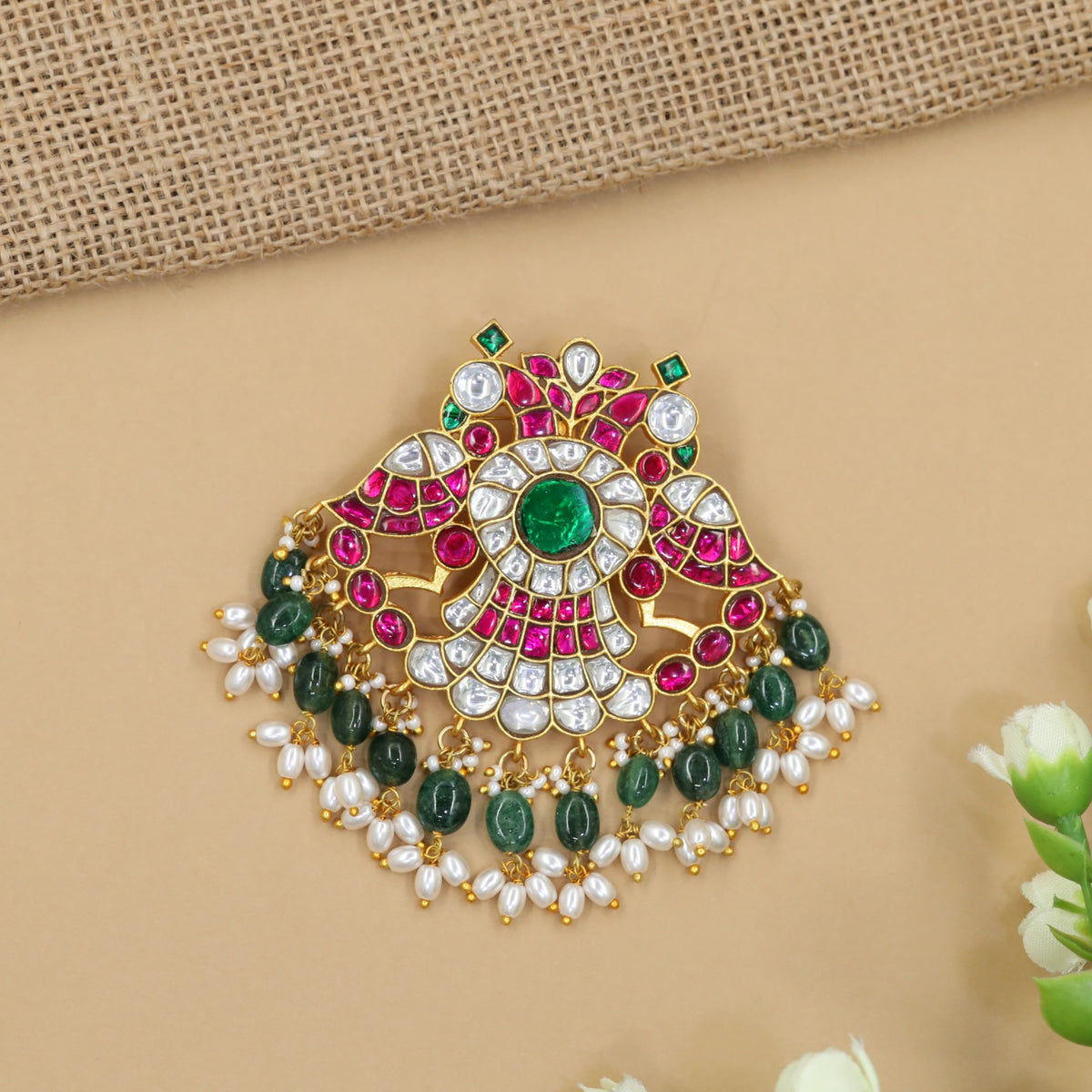 Jadau pendant with intricate peacock detailing and pearl fringe