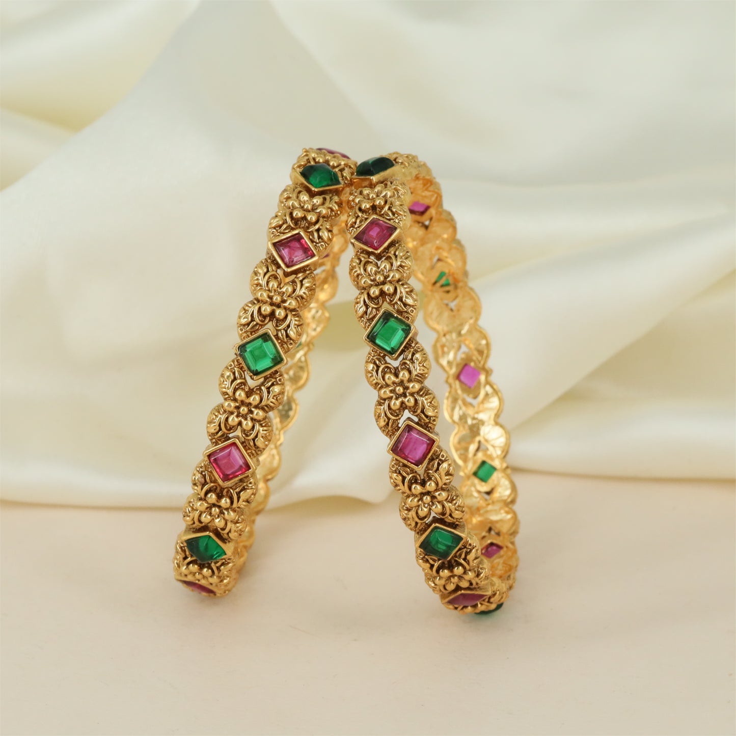 Antique Frame Bangles with Raised Floral Work and Oval Accent Placement