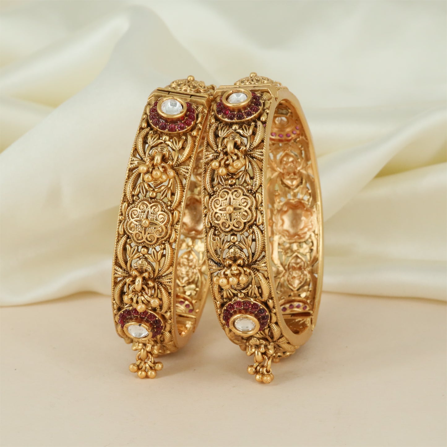 Royal Frame Antique Bangles with Floral Carved Panels and Hanging Drops