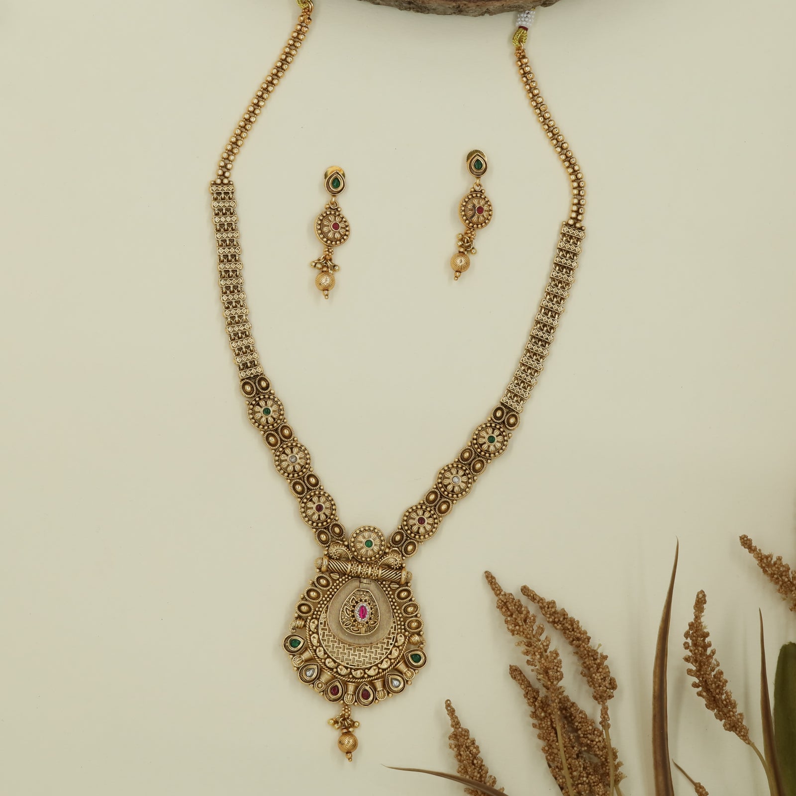 Grid disc long haara with compact links and central drop pendant