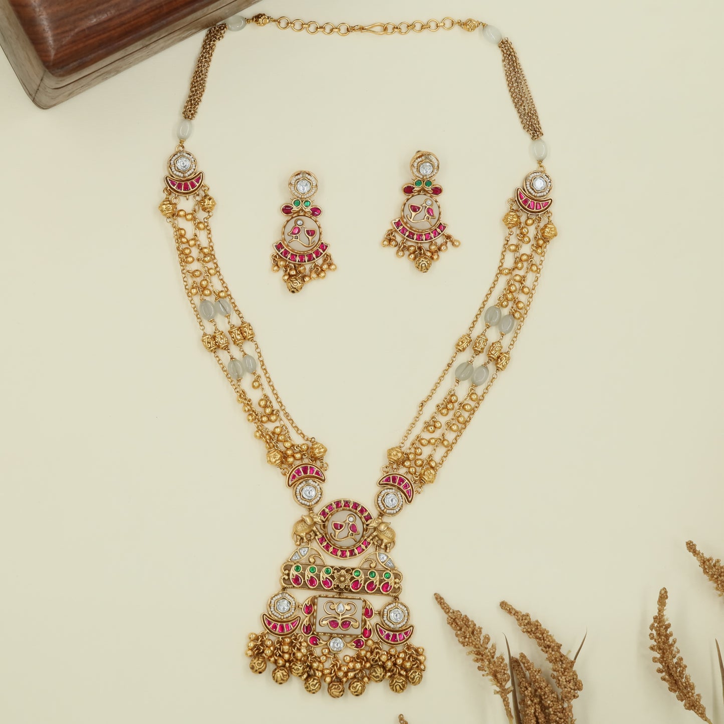 Multi strand kundan long haara with spaced oval beads and grand drop centerpiece