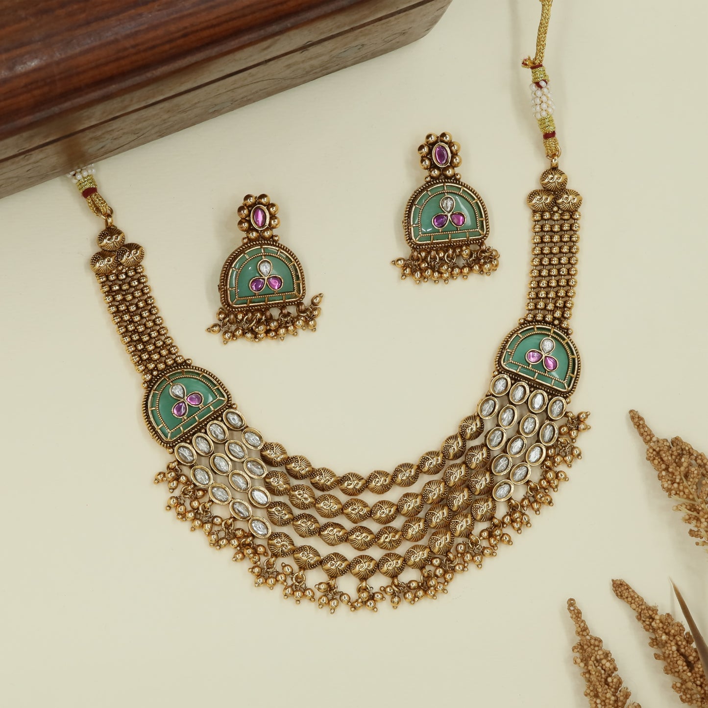 Joined row kundan necklace with clustered bead chains and fringe lower edge