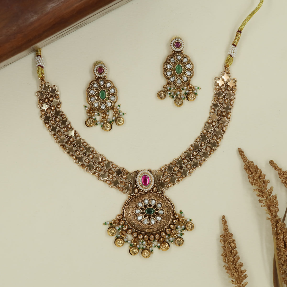 Flower lattice kundan necklace with repeating units and fringe drop pendant