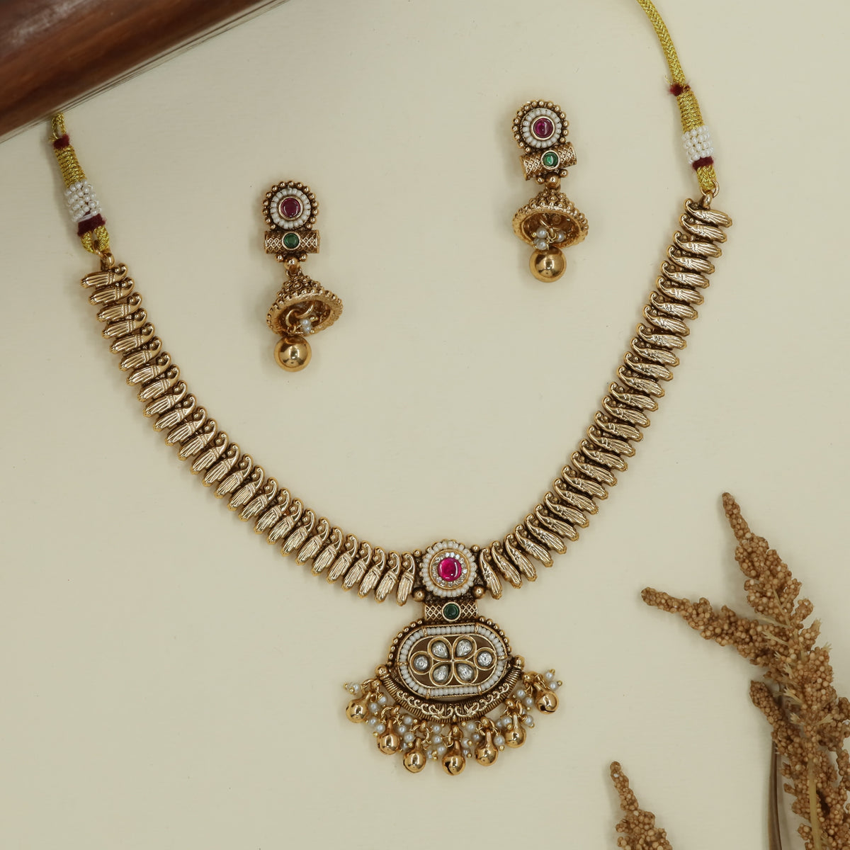 Spine pattern antique necklace with aligned curved links and hanging fringe
