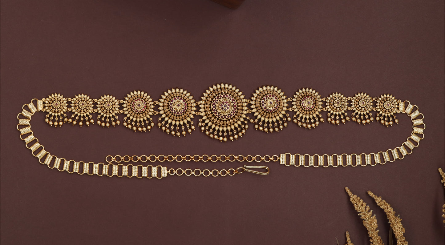 Sunburst medallion waist belt with graduated round panels and layered drop fringe