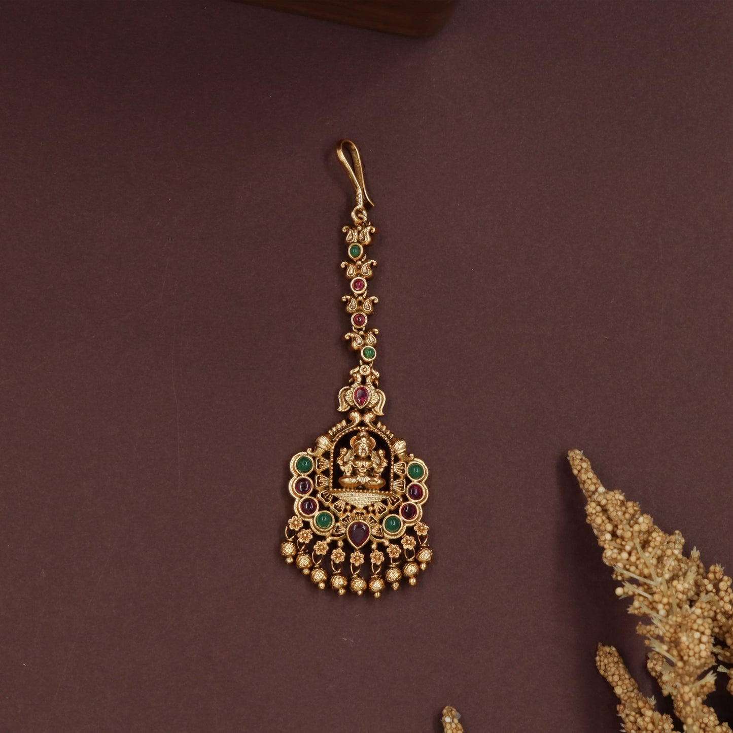 Temple lakshmi tikka with elongated link chain and circular drop pendant