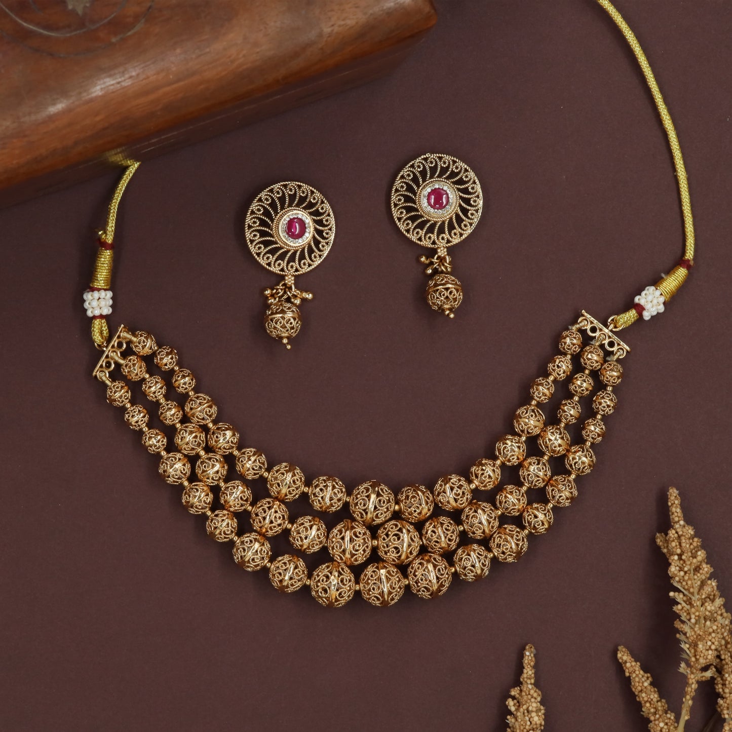 Ornate sphere antique necklace with openwork beads and tiered strand arrangement