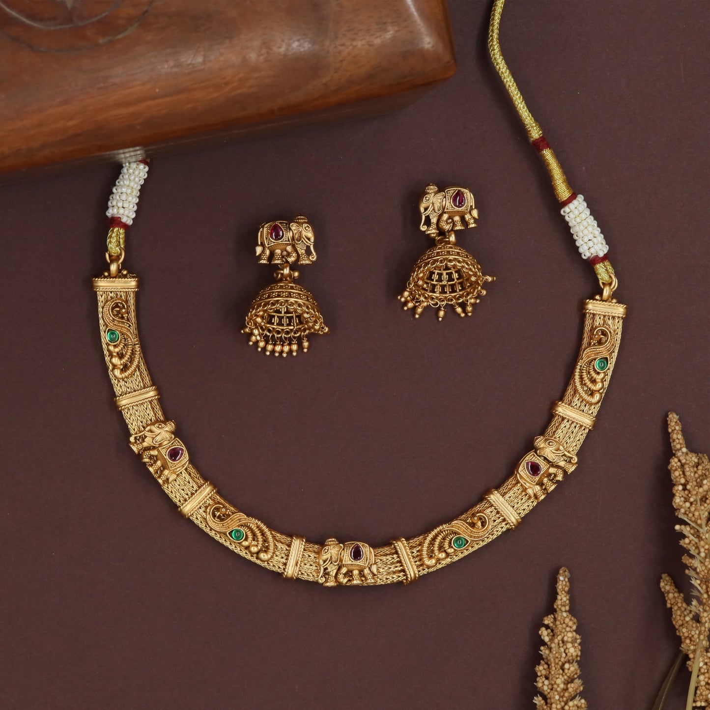 Intricate bar antique necklace with patterned links and repeated elephant units