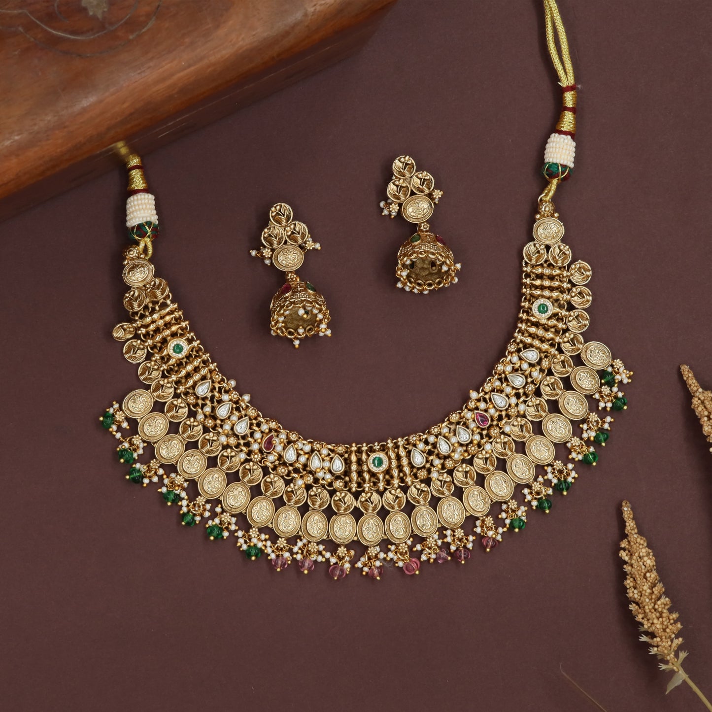 Layered coin kundan necklace with stacked rows and teardrop link detailing