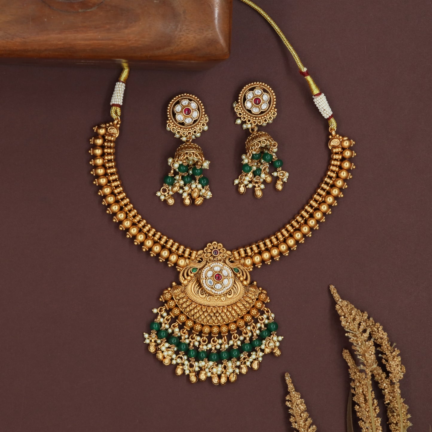 Dense bead kundan necklace with structured rows and scalloped pendant fringe