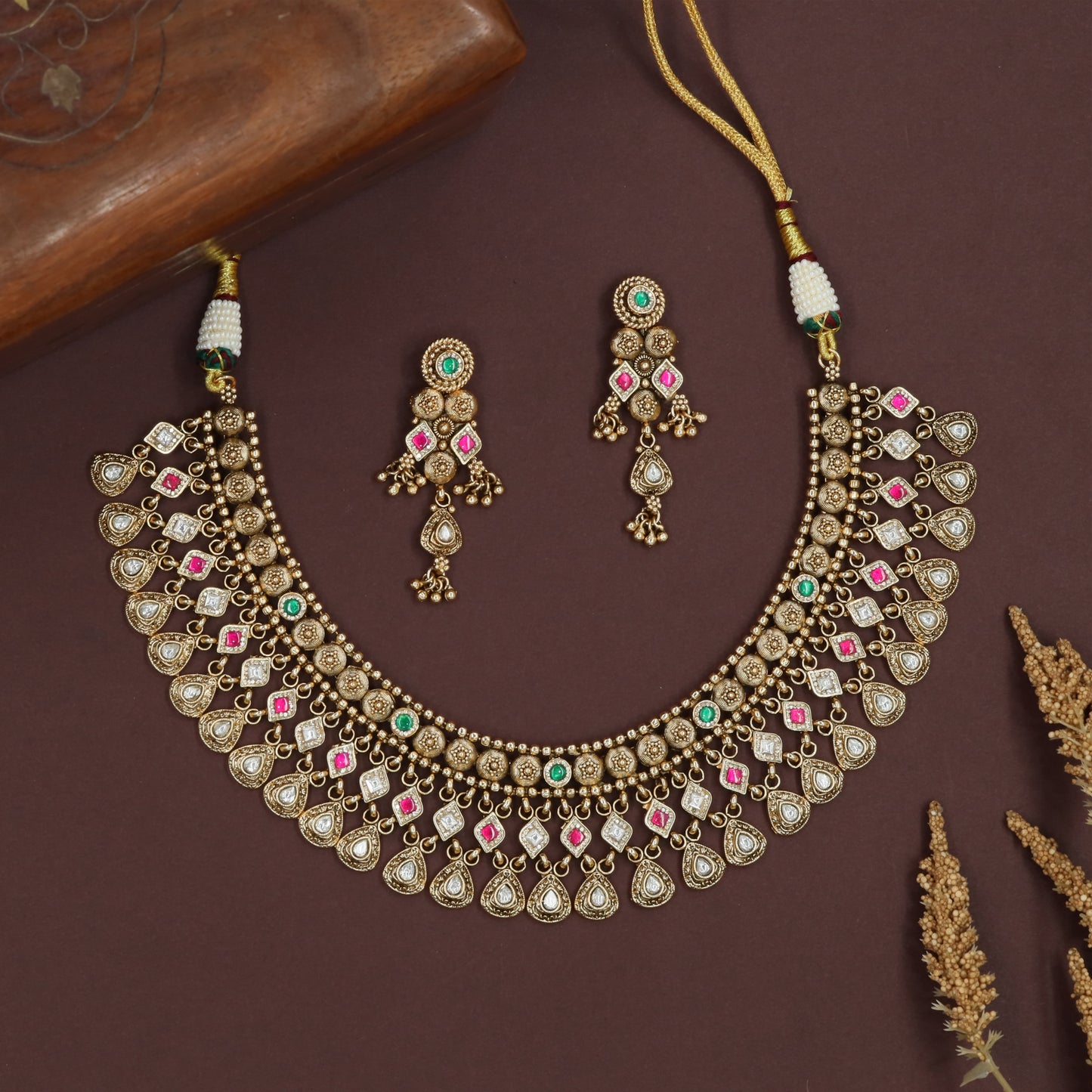 Bezel set kundan necklace with teardrop hangings and square connector accents