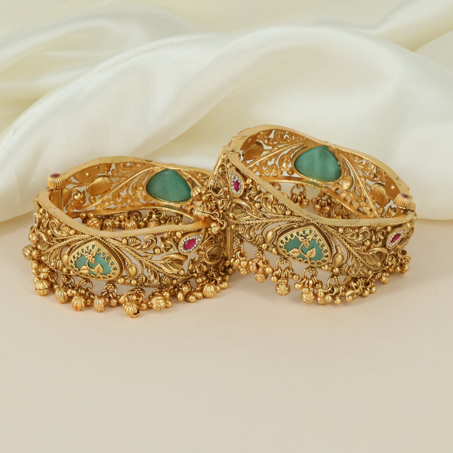 Designer ornamental motif Kundan bangles with intricate finish