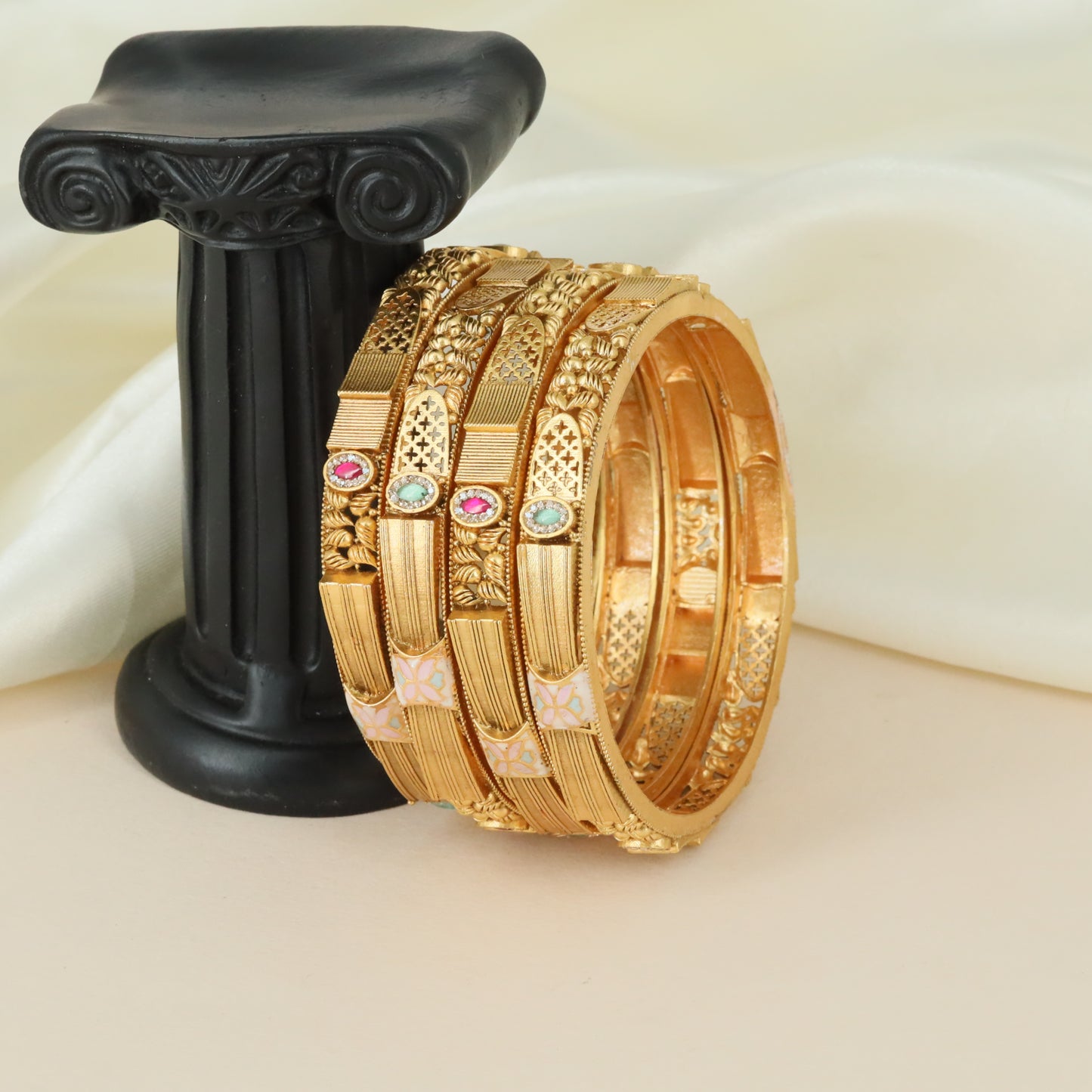 Floral motif artistry Kundan bangles with ornamental detailing