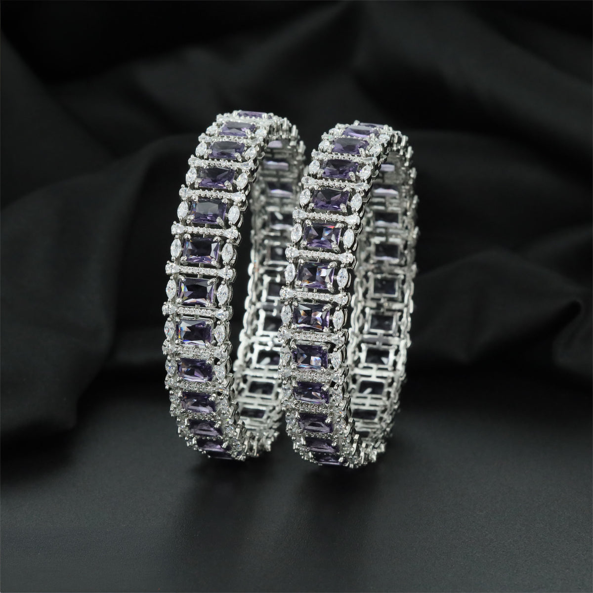 Rhodium bangles showcasing rectangular centre settings