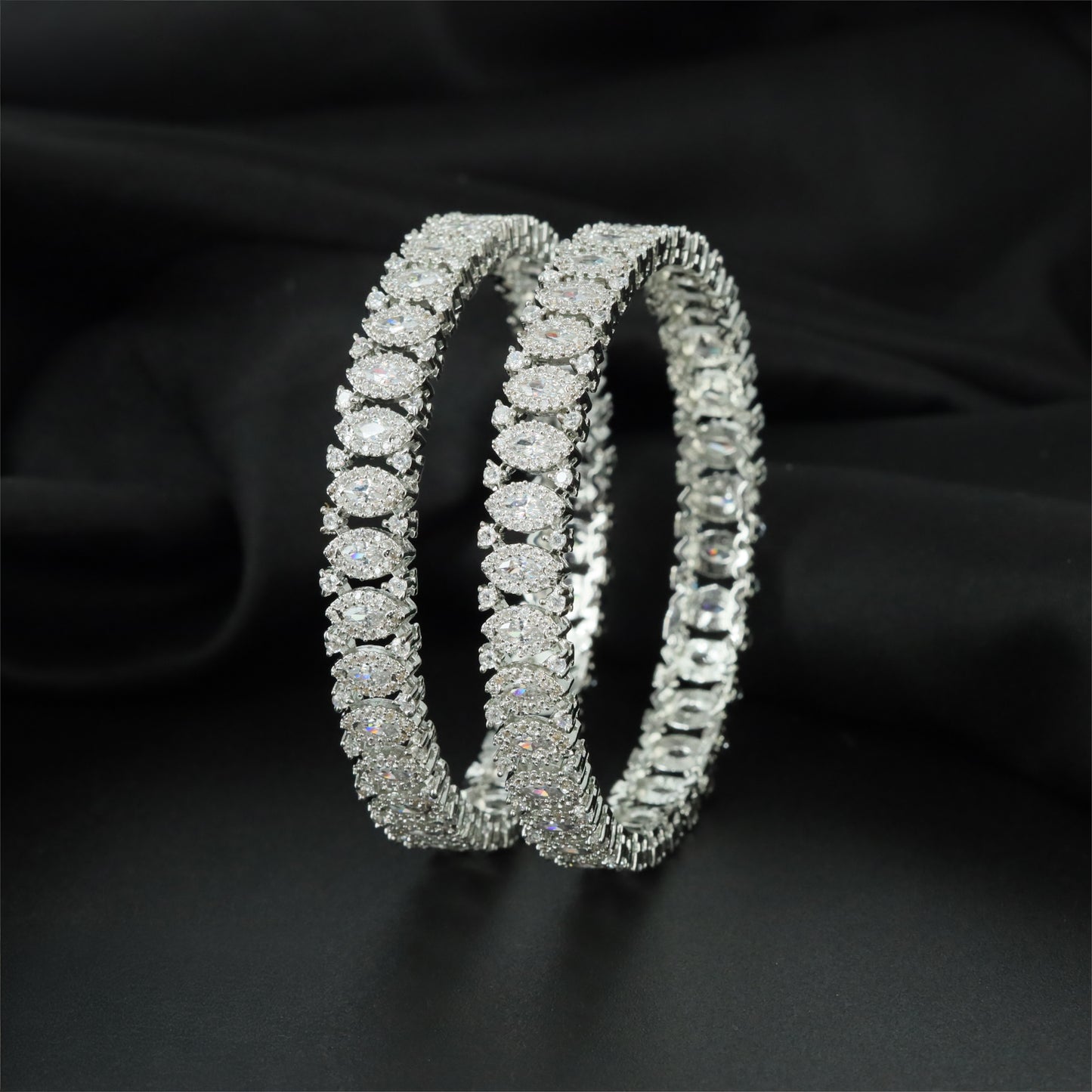 Elegant Rhodium Bangles Designed with Oval Cluster Links