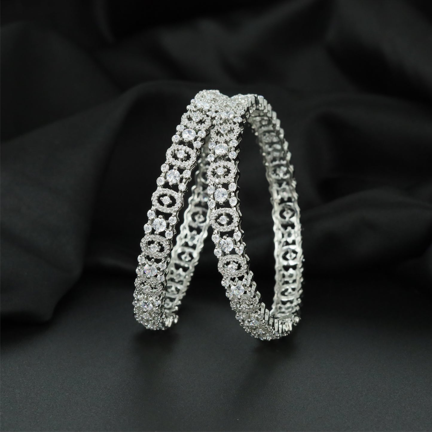 Infinity Circle Rhodium Bangles with Sculpted Open Gallery Detailing