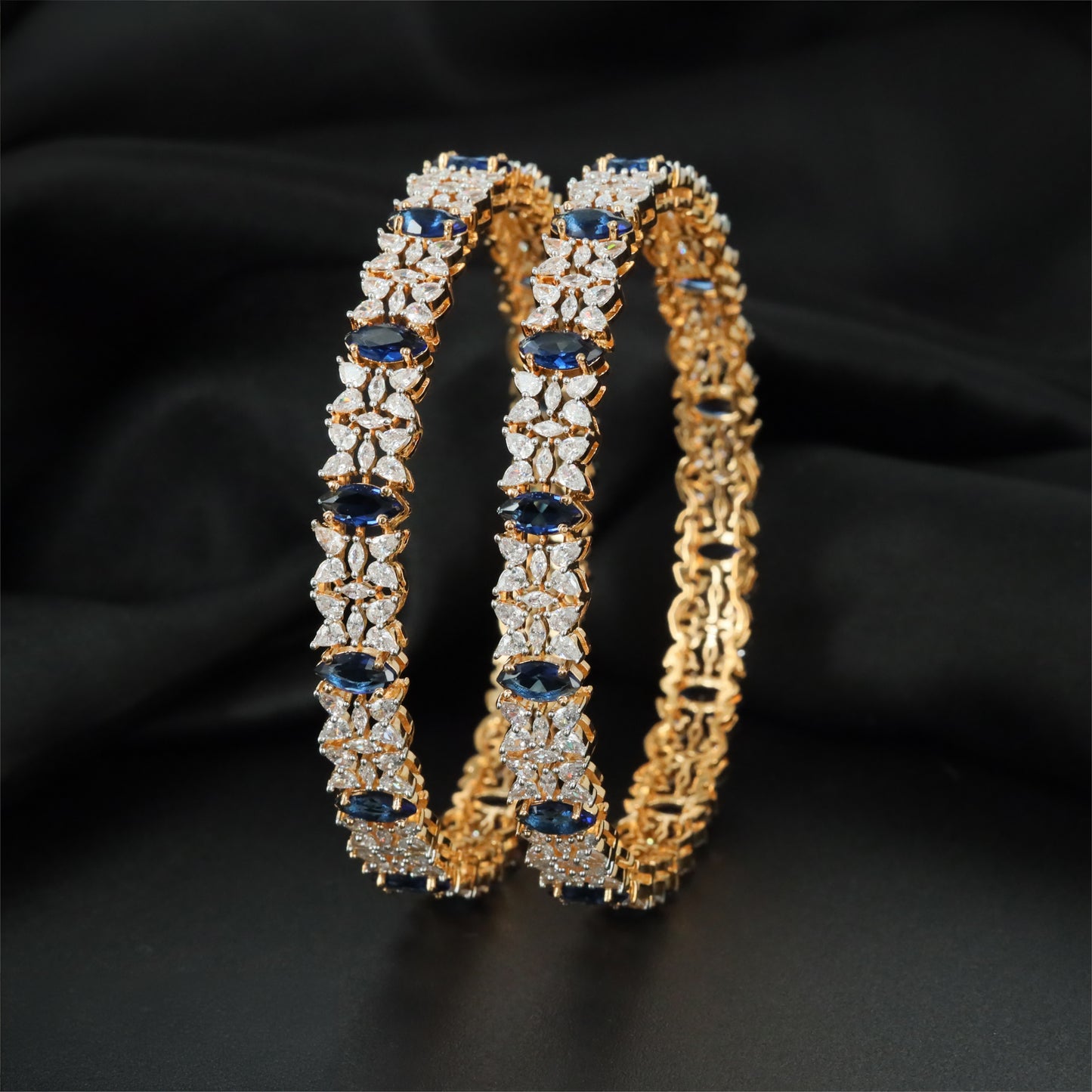 Modern GJ Bangles with Repeated Oval Accents and Sculpted Links