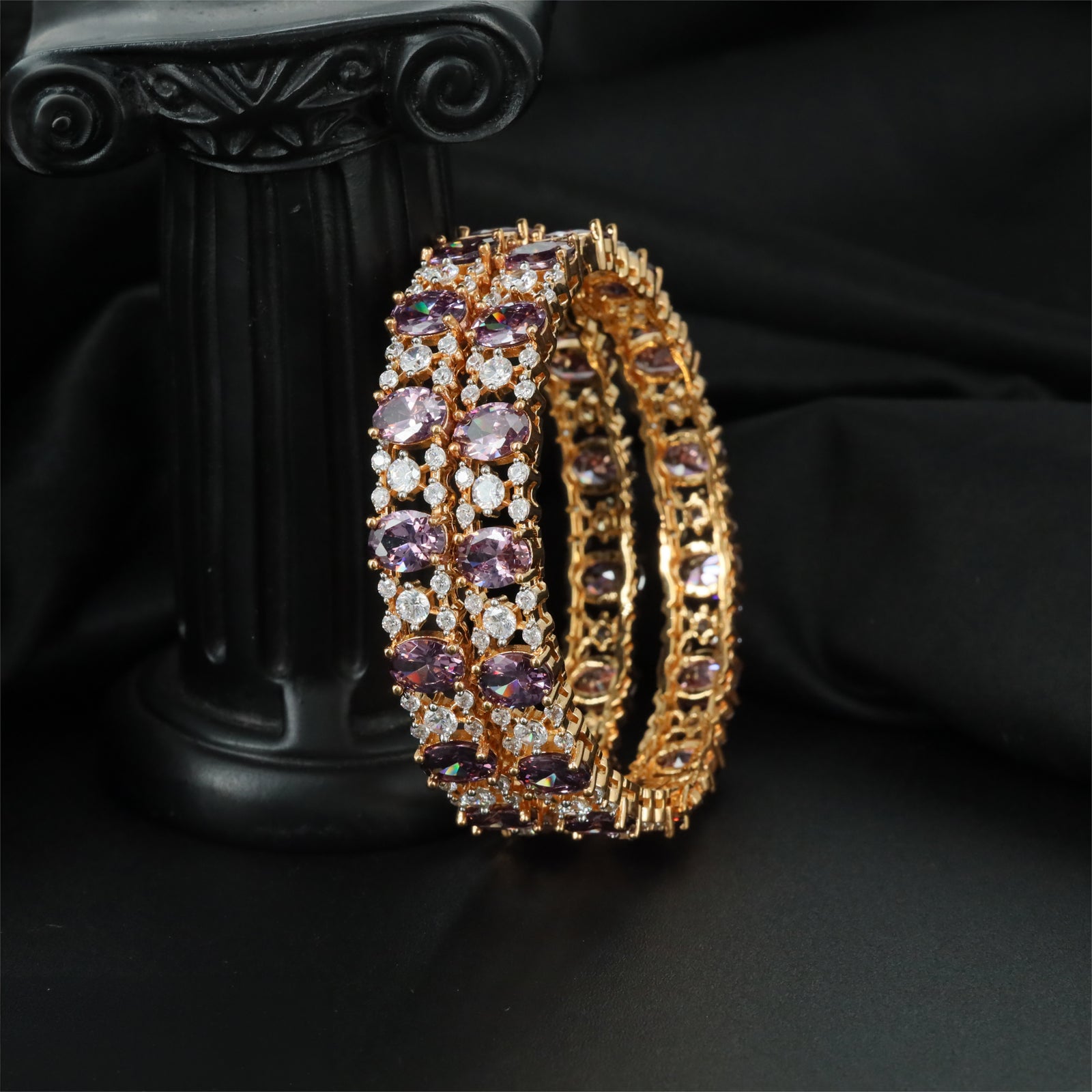 Graceful GJ Bangles Featuring Oval Settings and Petal Clusters