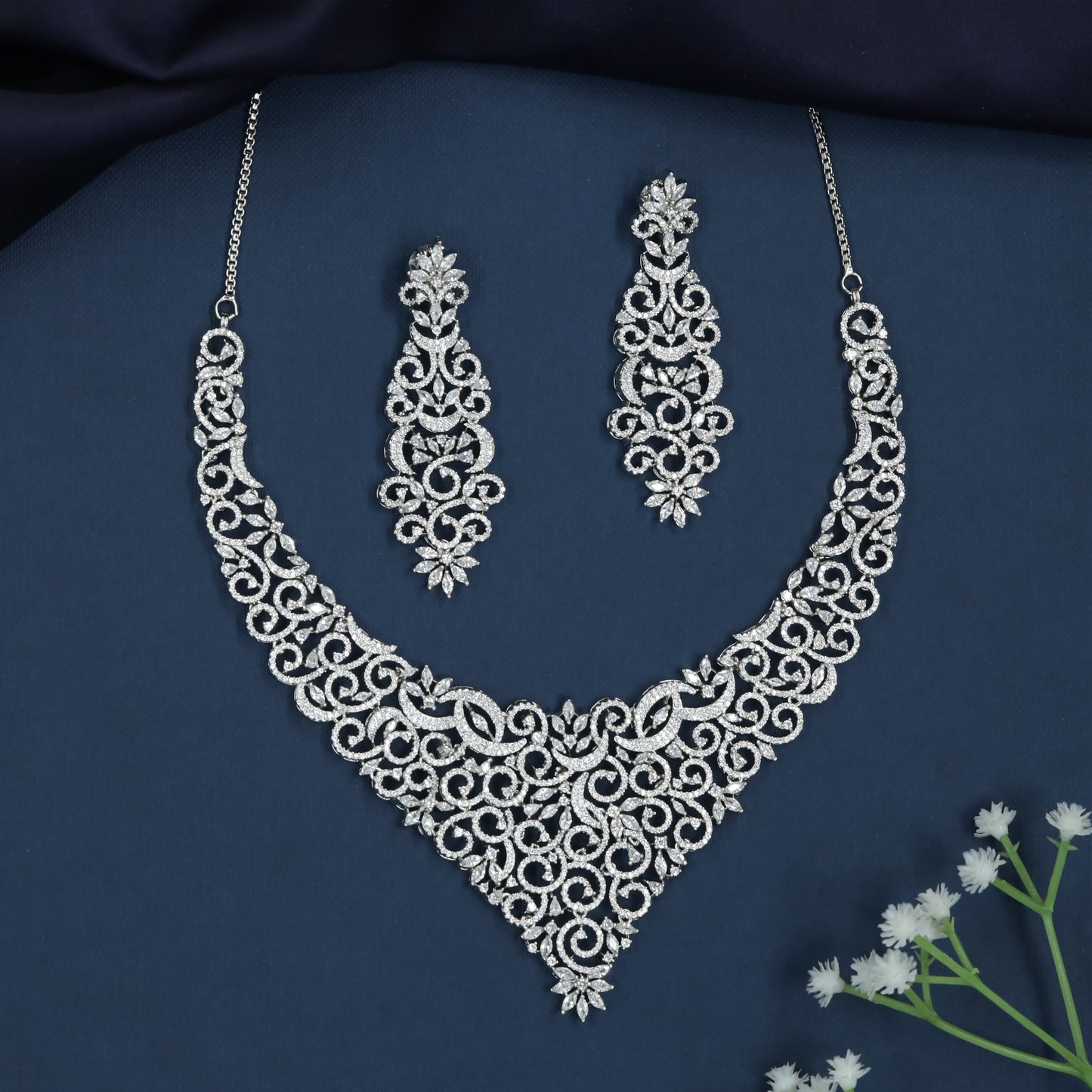 Braided Swirl Necklace with Decorative Floral Accents