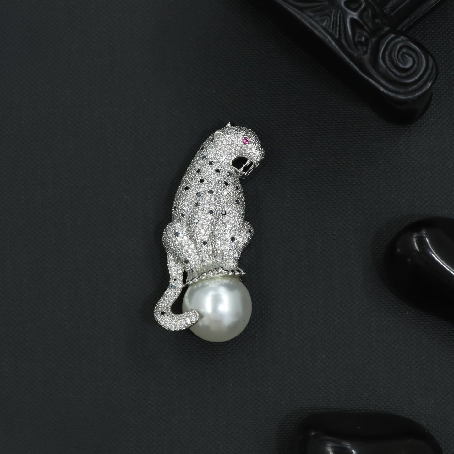 Wild Panther Rhodium Brooch Showcasing a Curved Tail and Sculpted Form