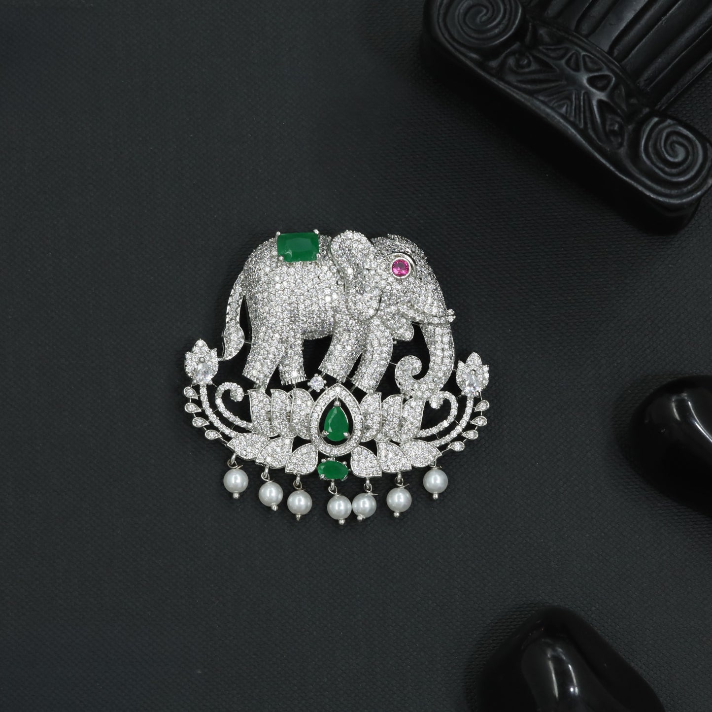 Elephant Rhodium Brooch with Floral Base and Curved Scrollwork