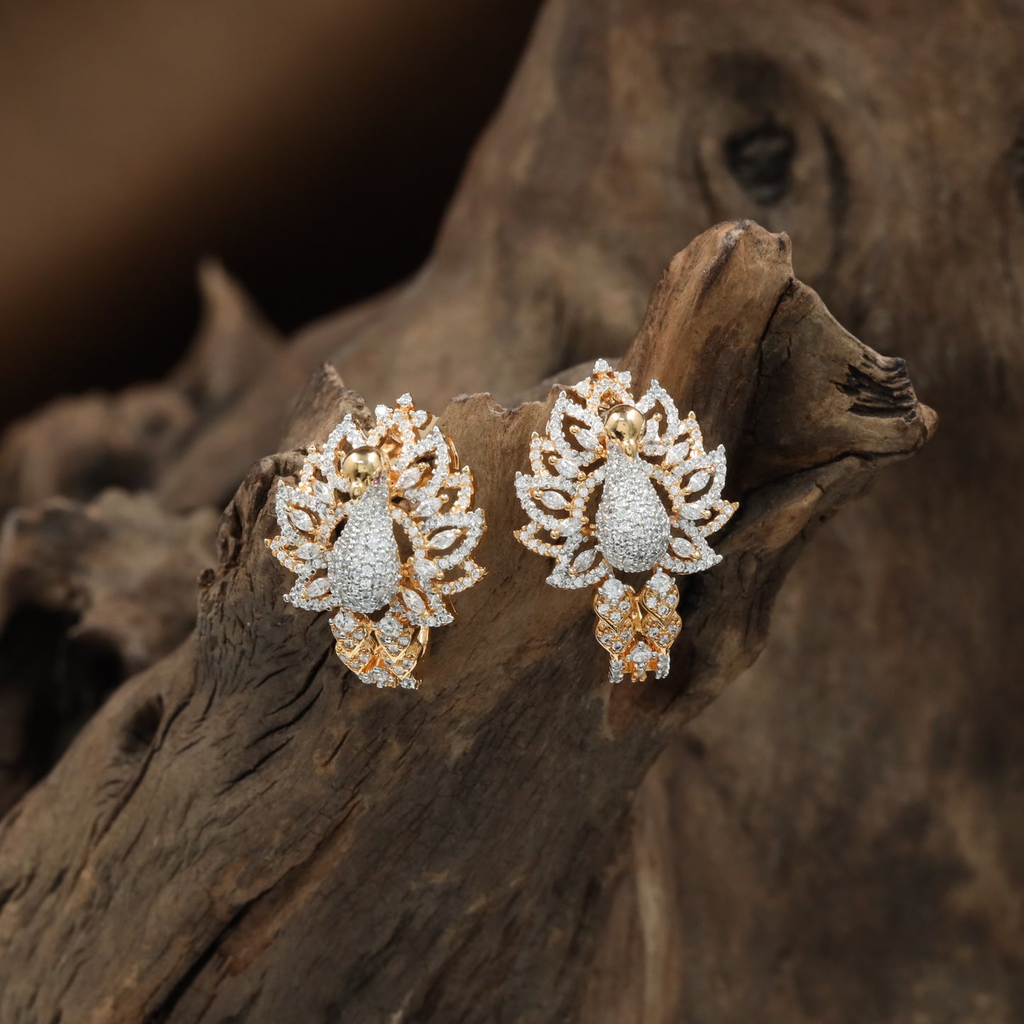 Grand Peacock Gj Stud with Open Wing Arrangement and Floral Detailing